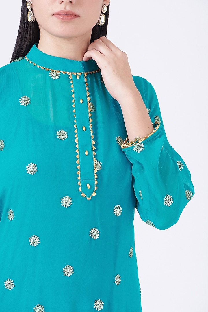 Turquoise Net Layered Gharara Set by Poshak apparels at Pernia's Pop Up Shop