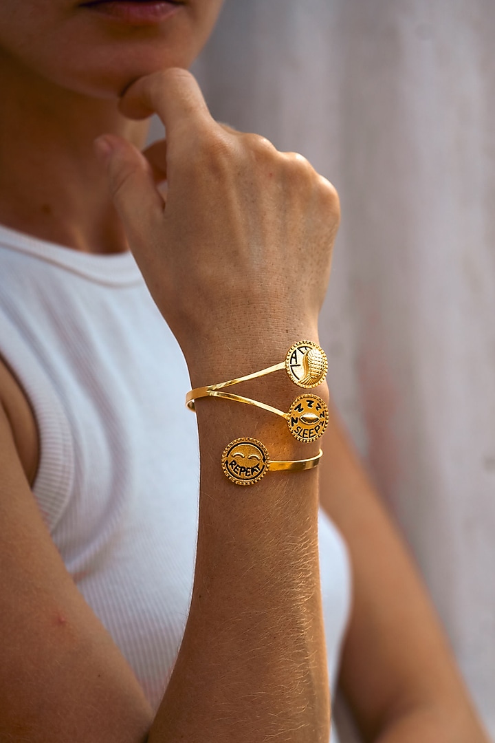 Gold Plated Eat Sleep Repeat Handcuff by PARISHRI at Pernia's Pop Up Shop