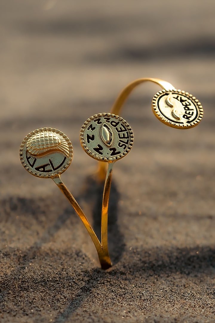 Gold Plated Eat Sleep Repeat Handcuff by PARISHRI at Pernia's Pop Up Shop