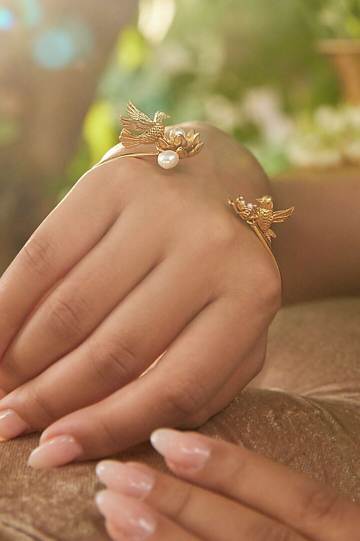 Antique Gold Finish Adjustable Flying Bird Palm Cuff by PARISHRI at Pernia's Pop Up Shop