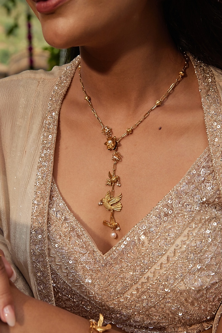 Antique Gold Finish Bird & Floral Charm Drop Down Necklace by PARISHRI at Pernia's Pop Up Shop