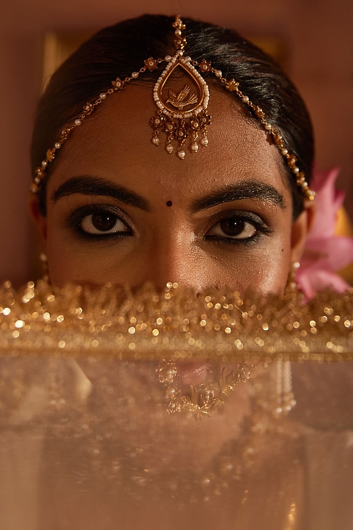 Antique Gold Finish Pearl & Flying Bird Motif Charm Mathapatti by PARISHRI at Pernia's Pop Up Shop