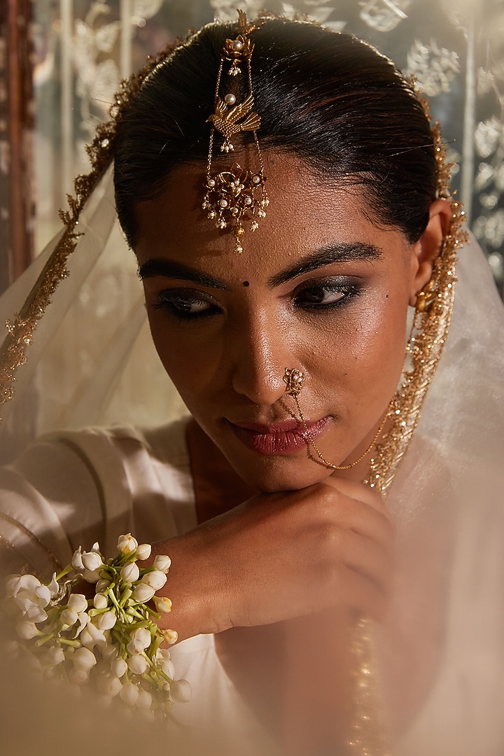 Antique Gold Finish Floral Maang Tikka by PARISHRI at Pernia's Pop Up Shop