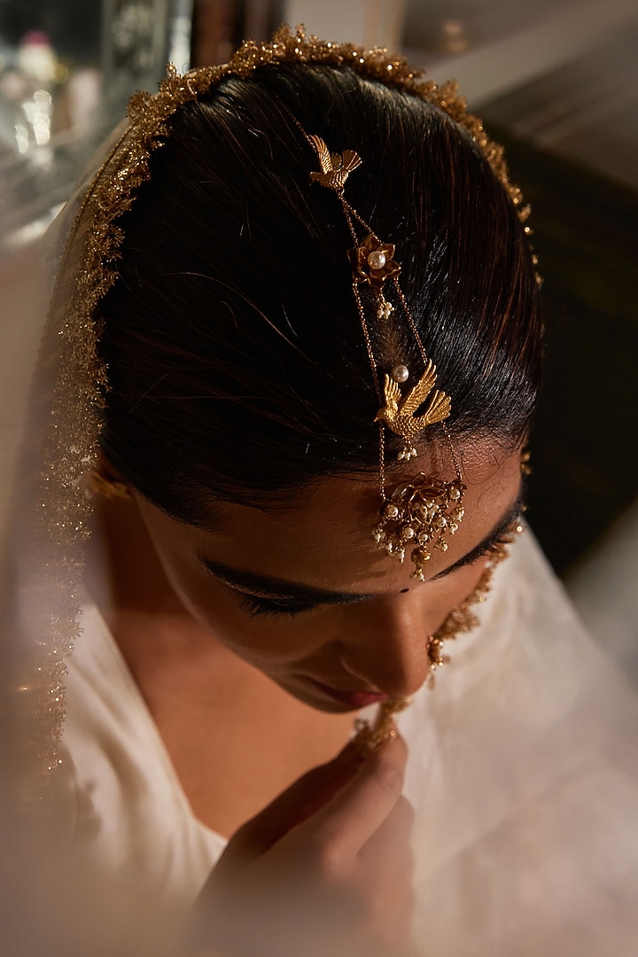 Antique Gold Finish Floral Maang Tikka by PARISHRI at Pernia's Pop Up Shop