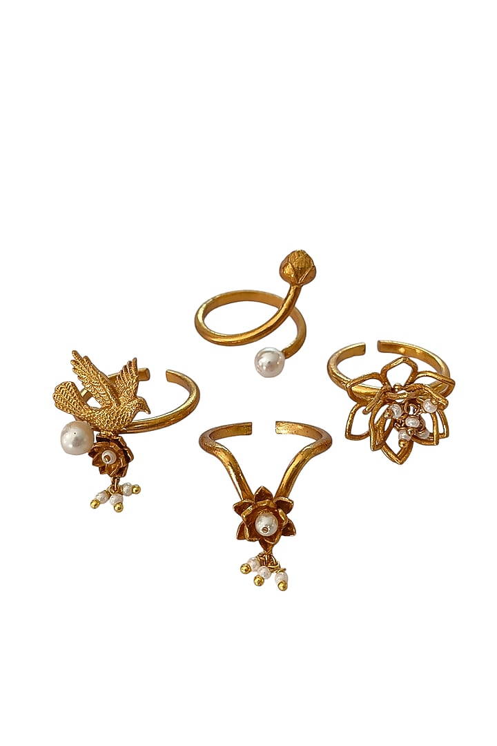 Antique Gold Finish Stackable Floral Ring (Set Of 4) by PARISHRI at Pernia's Pop Up Shop