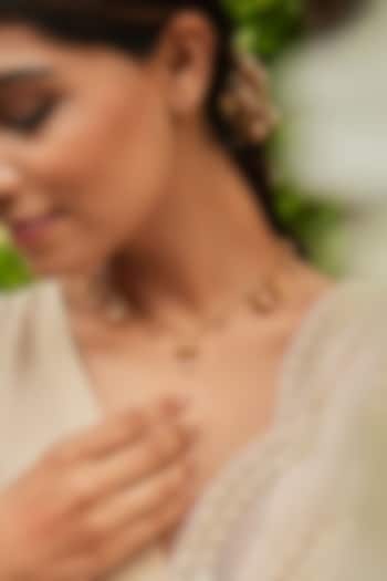 Antique Gold Finish Bird & Lotus Charm Necklace by PARISHRI at Pernia's Pop Up Shop