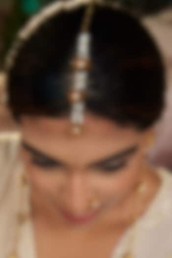 Antique Gold Finish Lotus Motif Maangtikka by PARISHRI at Pernia's Pop Up Shop