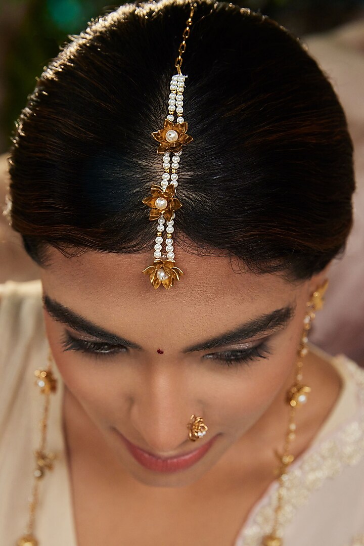 Antique Gold Finish Lotus Motif Maangtikka by PARISHRI at Pernia's Pop Up Shop