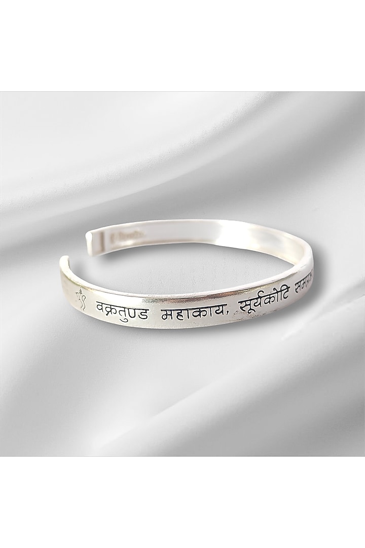 Silver Vakratunda Mahakaya Kada In Sterling Silver by PARISHRI at Pernia's Pop Up Shop