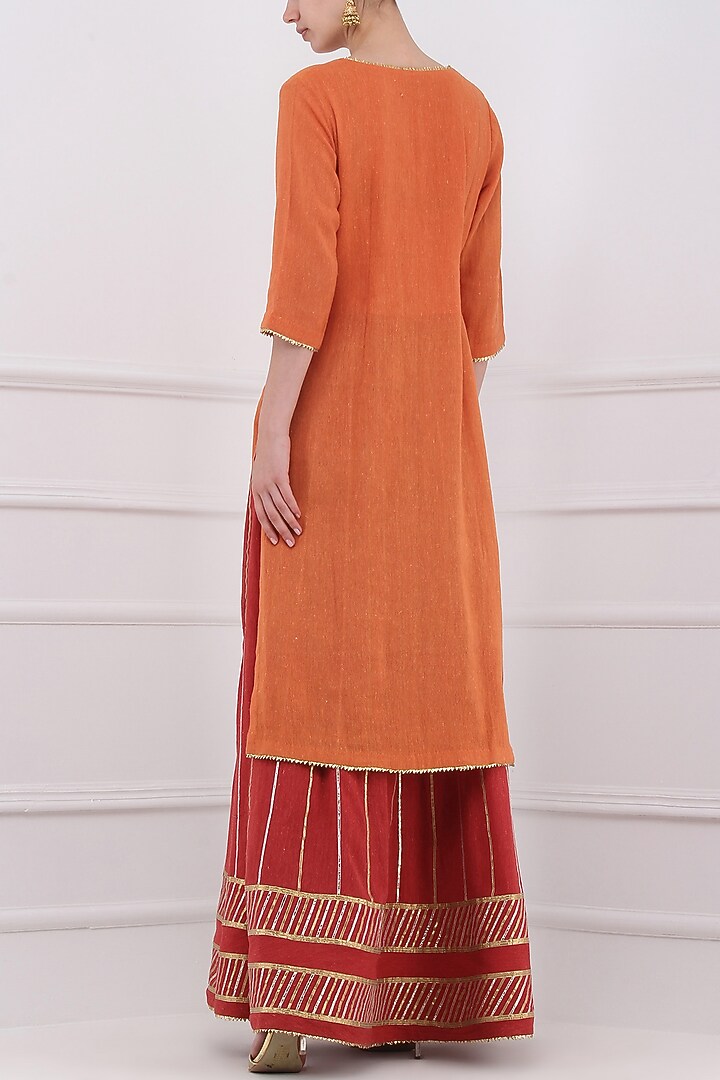 Red gota patti embroidered lehenga and orange kurta set available only at Pernia's Pop Up Shop.