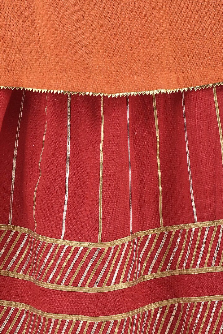 Red gota patti embroidered lehenga and orange kurta set available only at Pernia's Pop Up Shop.