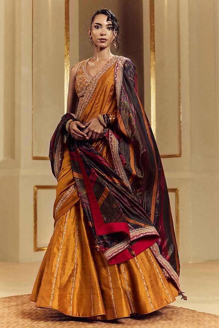 Mustard Raw Silk Mirror Work Wedding Lehenga Set by Punit Balana at Pernia's Pop Up Shop