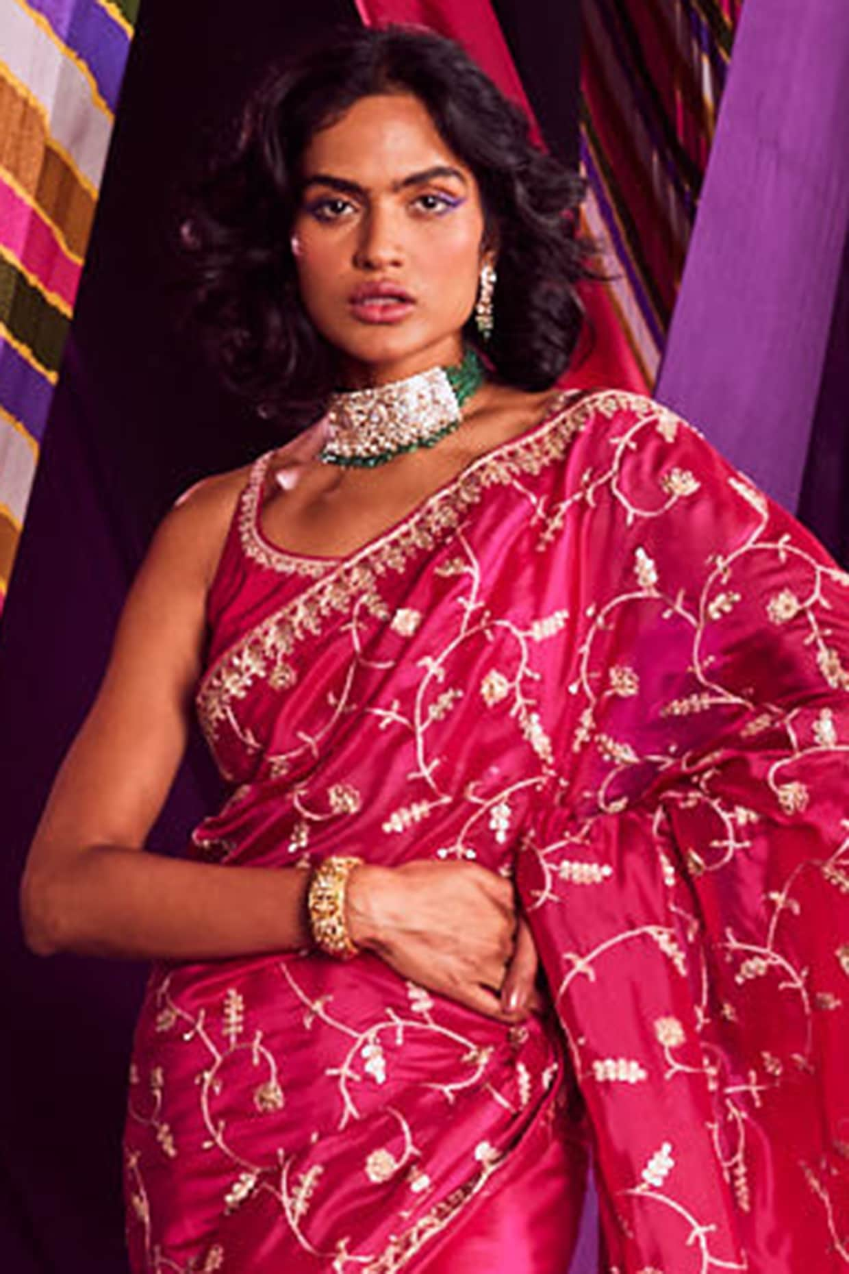 Photo of south indian bridal jewellery with layered necklaces and pink saree