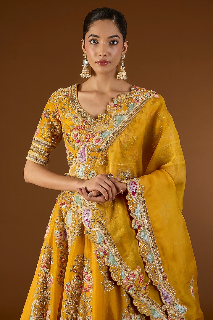Mustard Brocade & Organza Hand & Machine Embroidered Kali Bridal Lehenga Set by Petticoat Lane at Pernia's Pop Up Shop