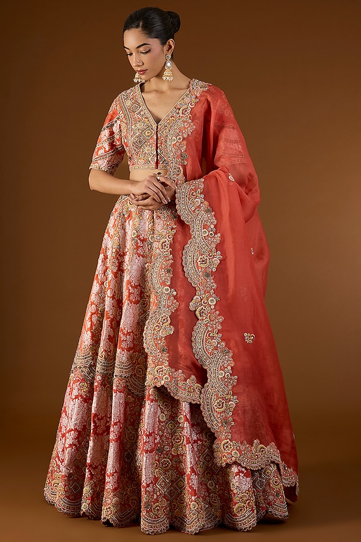 Red Shimmer Brocade & Organza Hand & Machine Embroidered Bridal Lehenga Set by Petticoat Lane at Pernia's Pop Up Shop