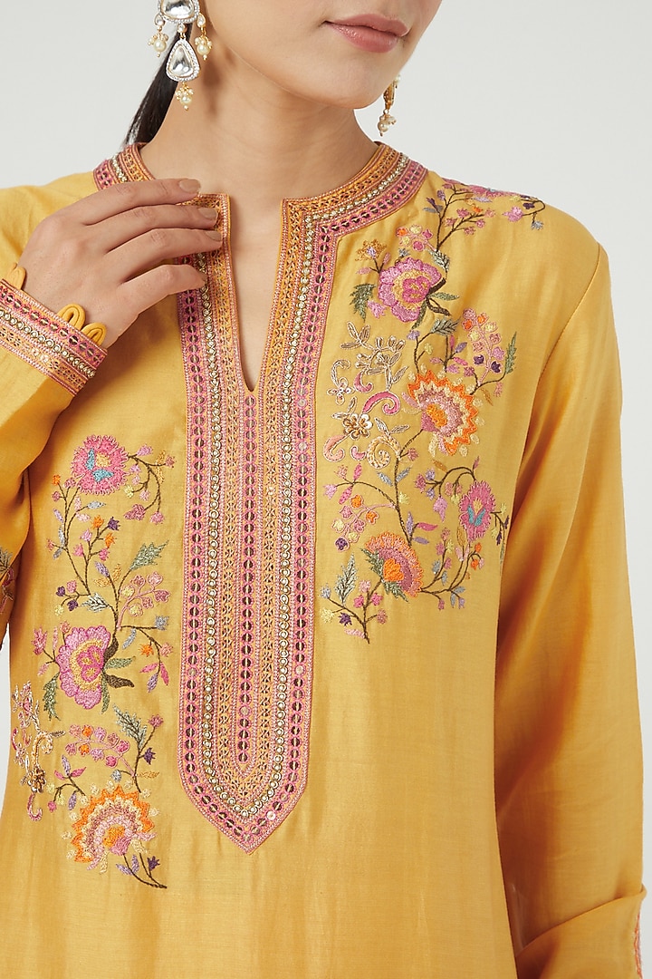 Mustard Asymmetrical Kurta Set With Embroidery by Petticoat Lane at Pernia's Pop Up Shop