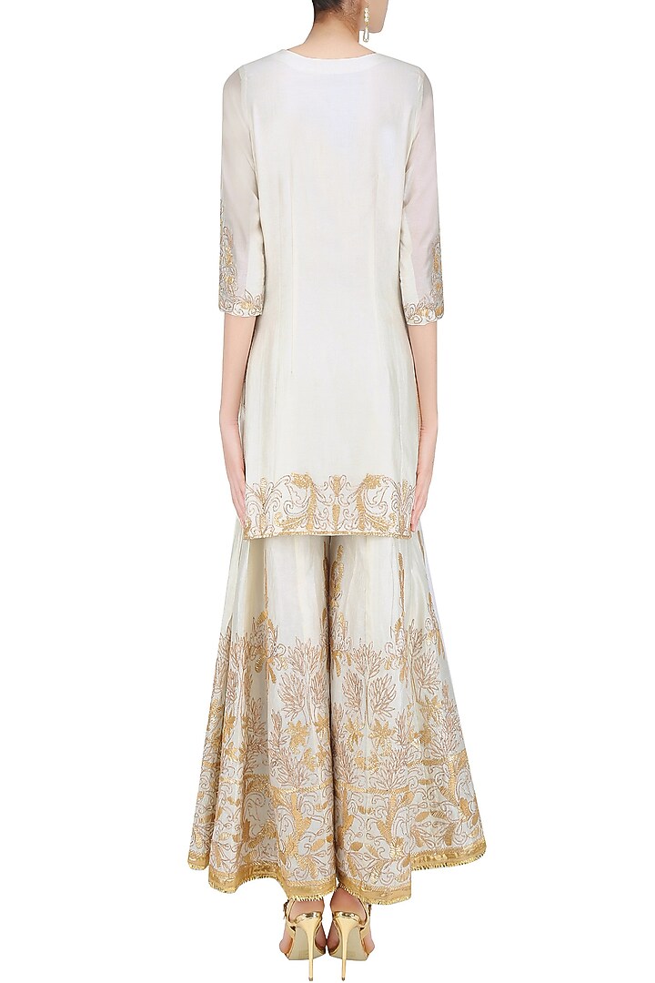 Ivory and gold gota patti embroidered kurta and sharara pants set available only at Pernia's Pop Up Shop.