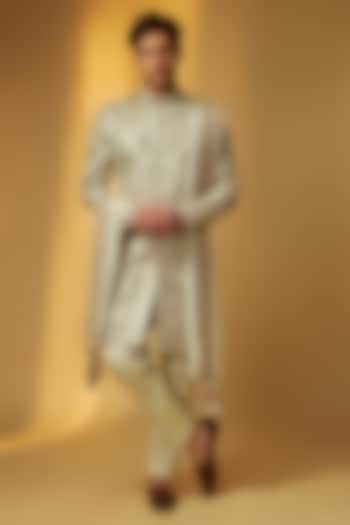 Green Gold Shimmer Tissue Zardosi Hand Embroidered Groom Sherwani Set by PARV DESIGN STUDIO at Pernia's Pop Up Shop