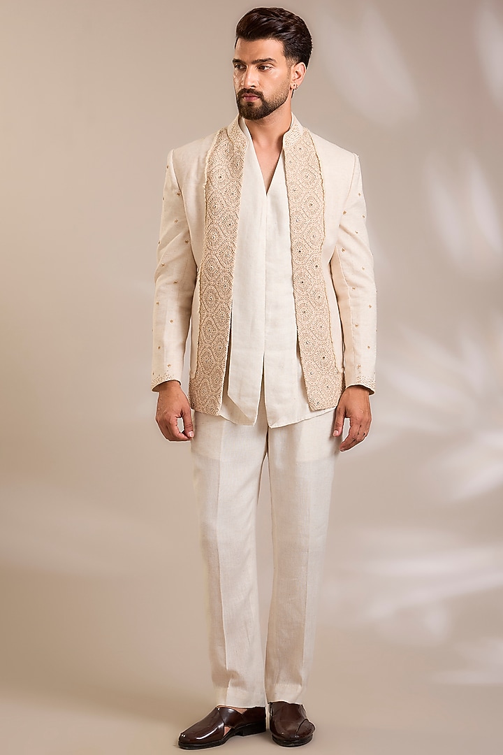 Beige Net Cutwork Embroidered Jacket Set by PARV DESIGN STUDIO at Pernia's Pop Up Shop