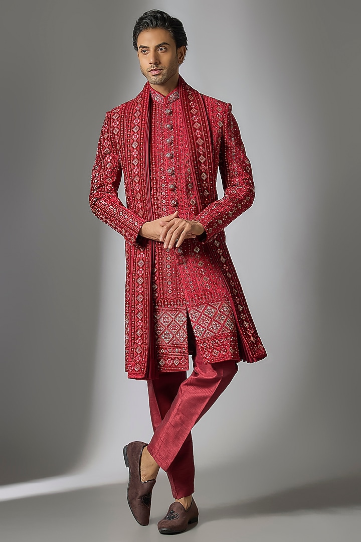 Red Knitted Velvet Cutdana & Zari Embroidered Sherwani Set by PARV DESIGN STUDIO