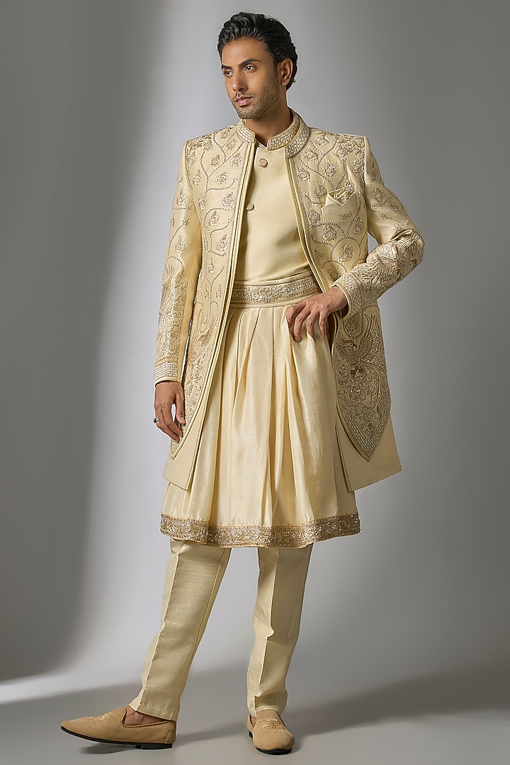 Gold Raw Silk Resham & Cutdana Embroidered Sherwani Set by PARV DESIGN STUDIO