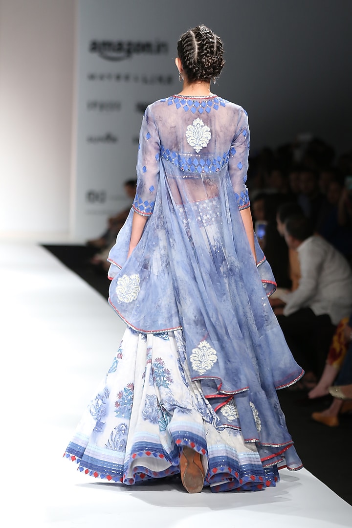 Indigo and white block printed lehenga with crop top and asymmetrical jacket available only at Pernia's Pop Up Shop.