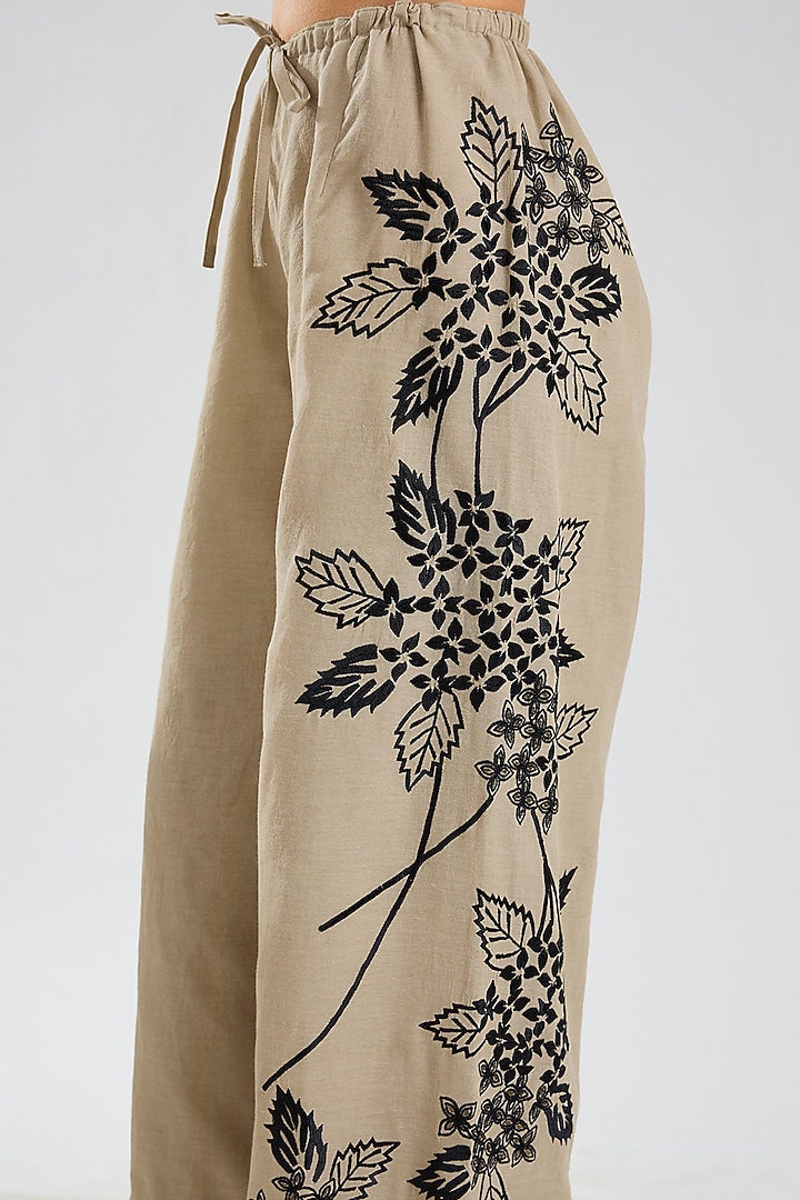 Natural Beige & Black Handloom Cotton Thread Embroidered Pants by Peachoo at Pernia's Pop Up Shop