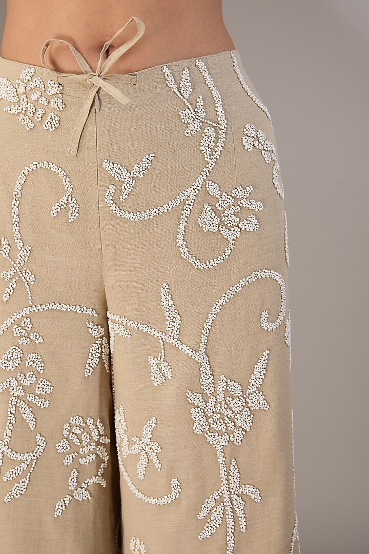 Beige Handloom Cotton Bead Embroidered Pants by Peachoo at Pernia's Pop Up Shop