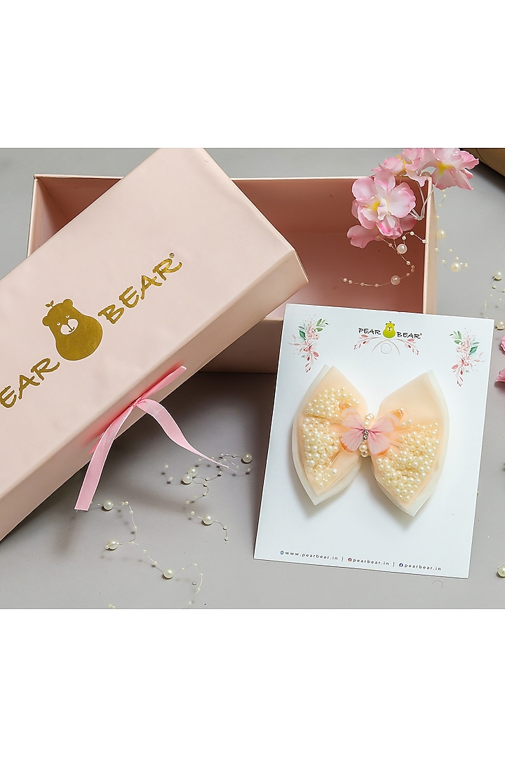 Peach & Off-White Net Pearl Work Bow Hair Clip For Girls by PEAR BEAR at Pernia's Pop Up Shop