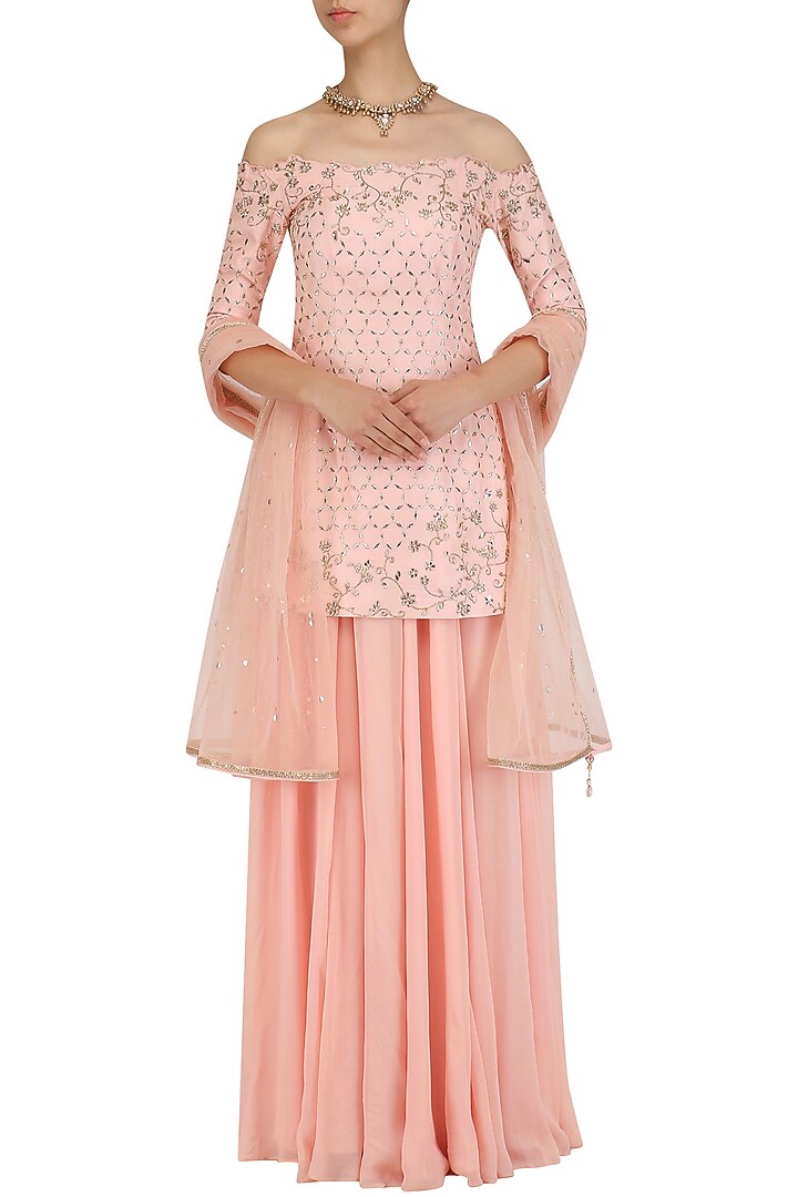 Peach off shoulder cutwork kurta and sharara set available only at Pernia's Pop Up Shop.