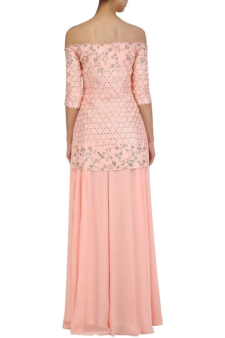 Peach off shoulder cutwork kurta and sharara set available only at Pernia's Pop Up Shop.