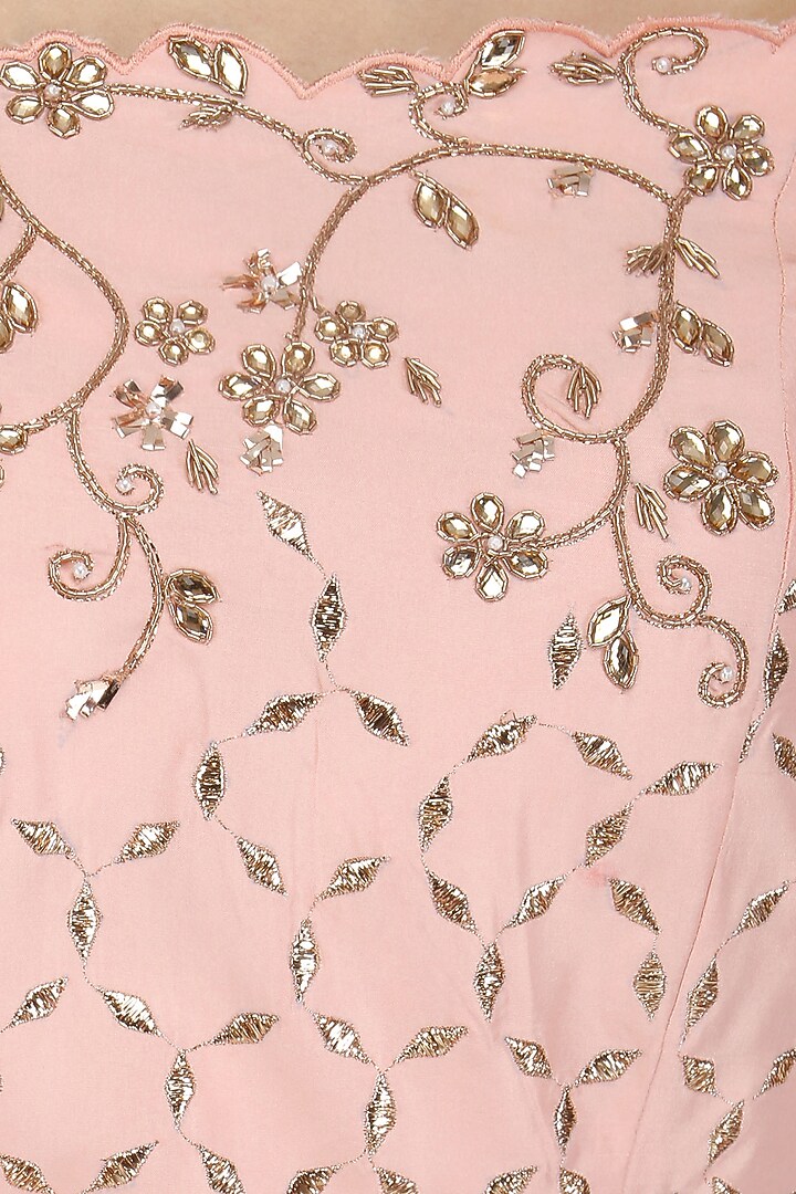 Peach off shoulder cutwork kurta and sharara set available only at Pernia's Pop Up Shop.