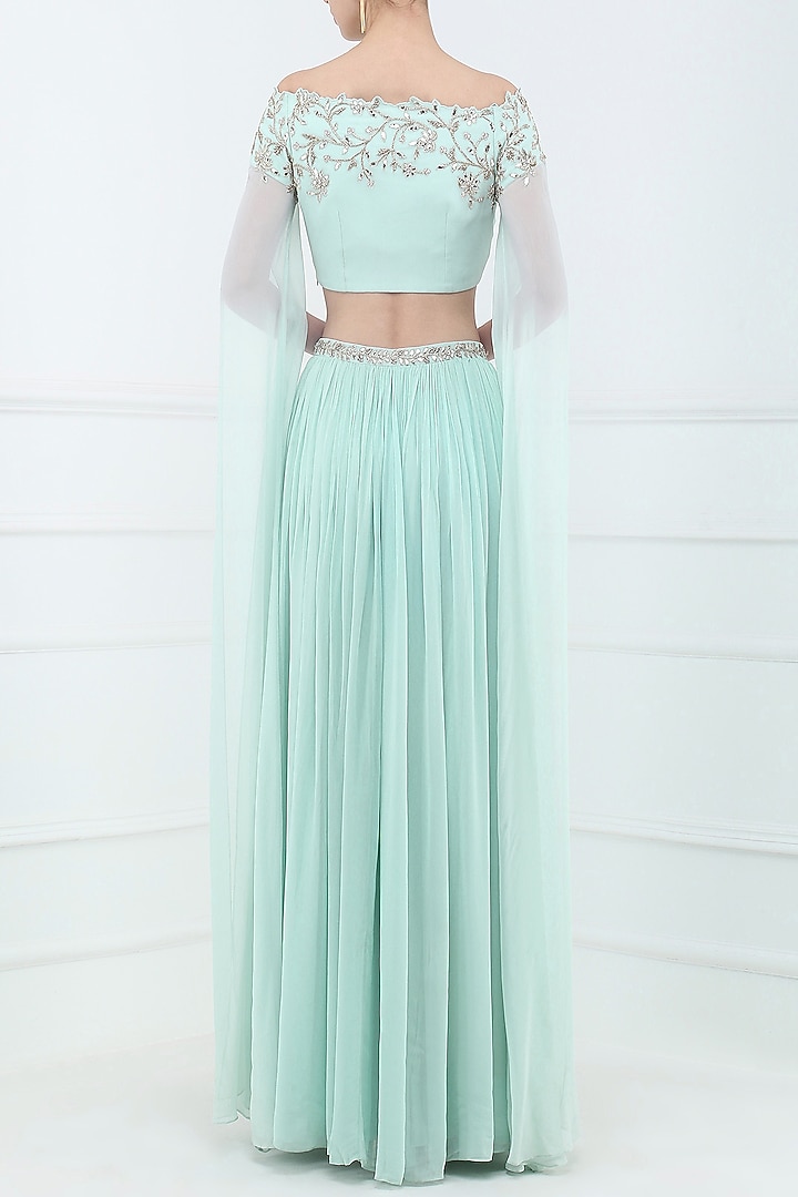 Pastel blue embroidered off shoulder crop top with lehenga skirt available only at Pernia's Pop Up Shop.