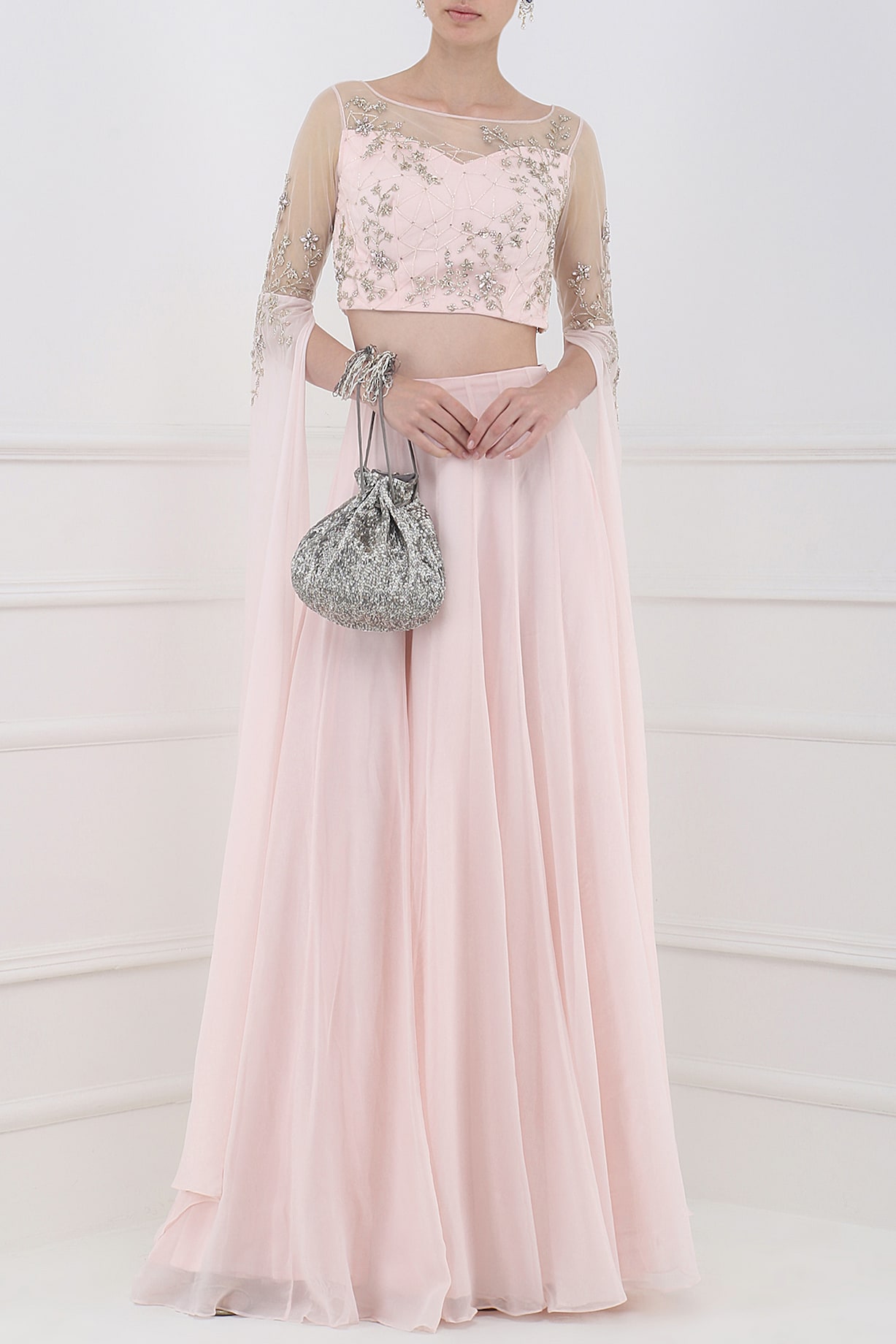 Pastel pink embroidered cape sleeves crop top with lehenga skirt