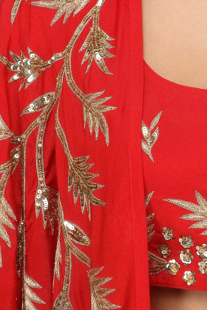 Red lehenga and embroidered cape set available only at Pernia's Pop Up Shop.