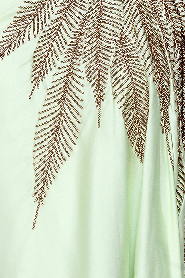 Mint green and gold leaves beads embroidered one shoulder dress and black dhoti pants set available only at Pernia's Pop Up Shop.