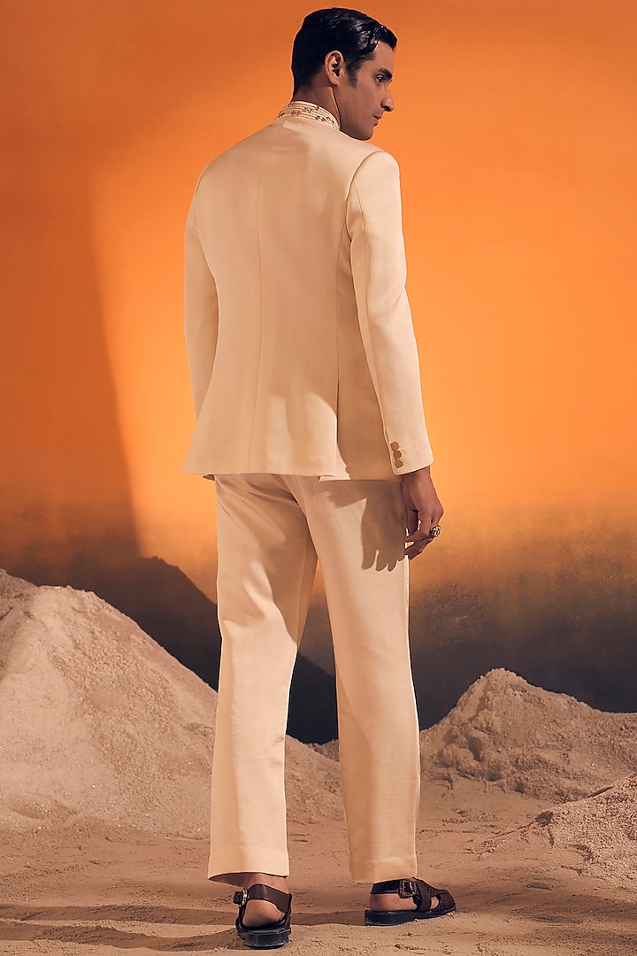 Ivory Raw Silk Satin Zari Embroidered Bandhgala by Philocaly at Pernia's Pop Up Shop
