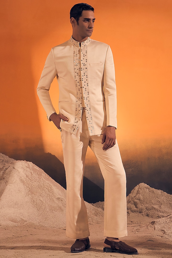 Ivory Raw Silk Satin Zari Embroidered Bandhgala by Philocaly at Pernia's Pop Up Shop