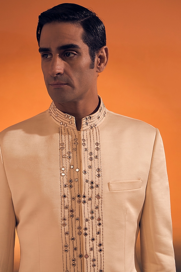 Ivory Raw Silk Satin Zari Embroidered Bandhgala by Philocaly at Pernia's Pop Up Shop