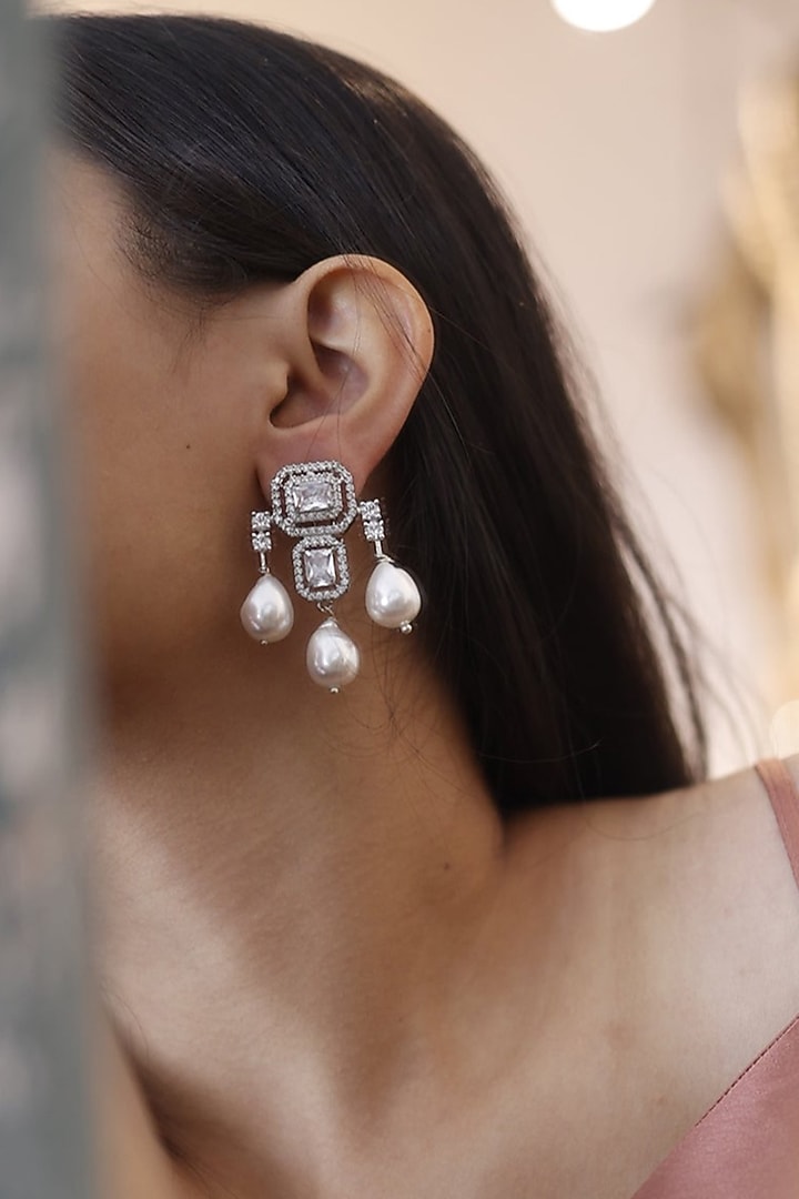 White Rhodium Finish Faux Diamond Dangler Earrings by Do Taara at Pernia's Pop Up Shop
