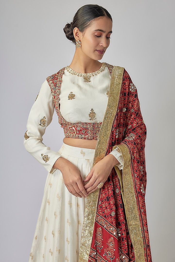 Off-White & Red Banarasi Chanderi Ajrakh Zari Hand Embroidered Wedding Lehenga Set by Priyanka Jha at Pernia's Pop Up Shop