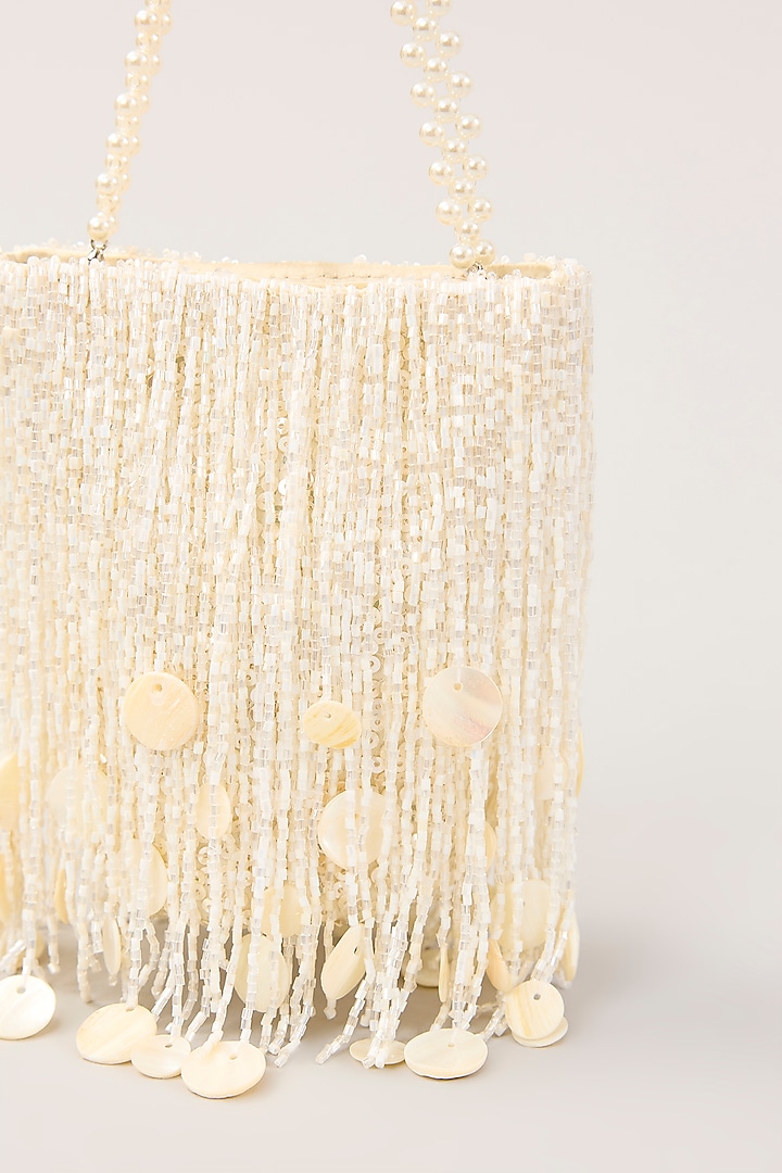 White Satin Tassel Hand Embellished Potli by PLODE at Pernia's Pop Up Shop