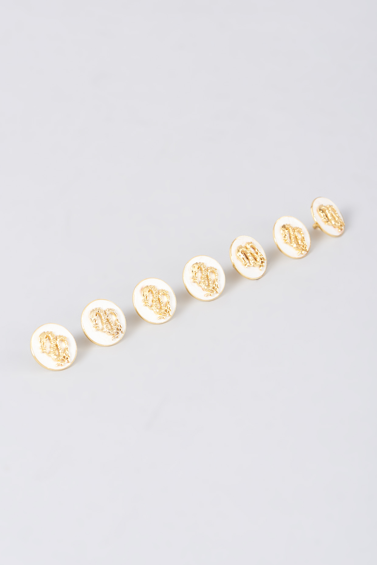 Gold Finish Ivory Enameled Sherwani Buttons Set In 92.5 Sterling Silver (Set of 7) by Plume Men at Pernia's Pop Up Shop