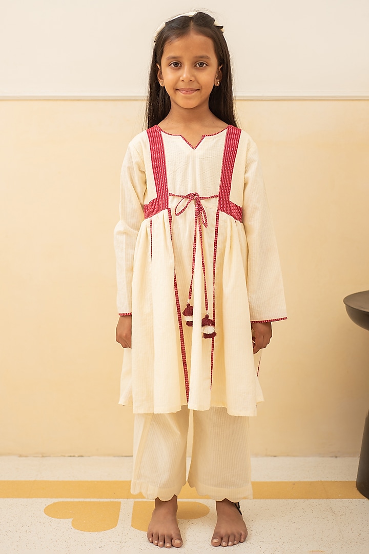 Maroon & Off-White Cotton Tassel Kalidar Kurta Set For Girls by PLUMCHEEKS at Pernia's Pop Up Shop