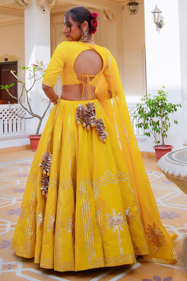 Yellow Organza Gota Patti Hand Embroidered Wedding Lehenga Set by Pomcha Jaipur at Pernia's Pop Up Shop
