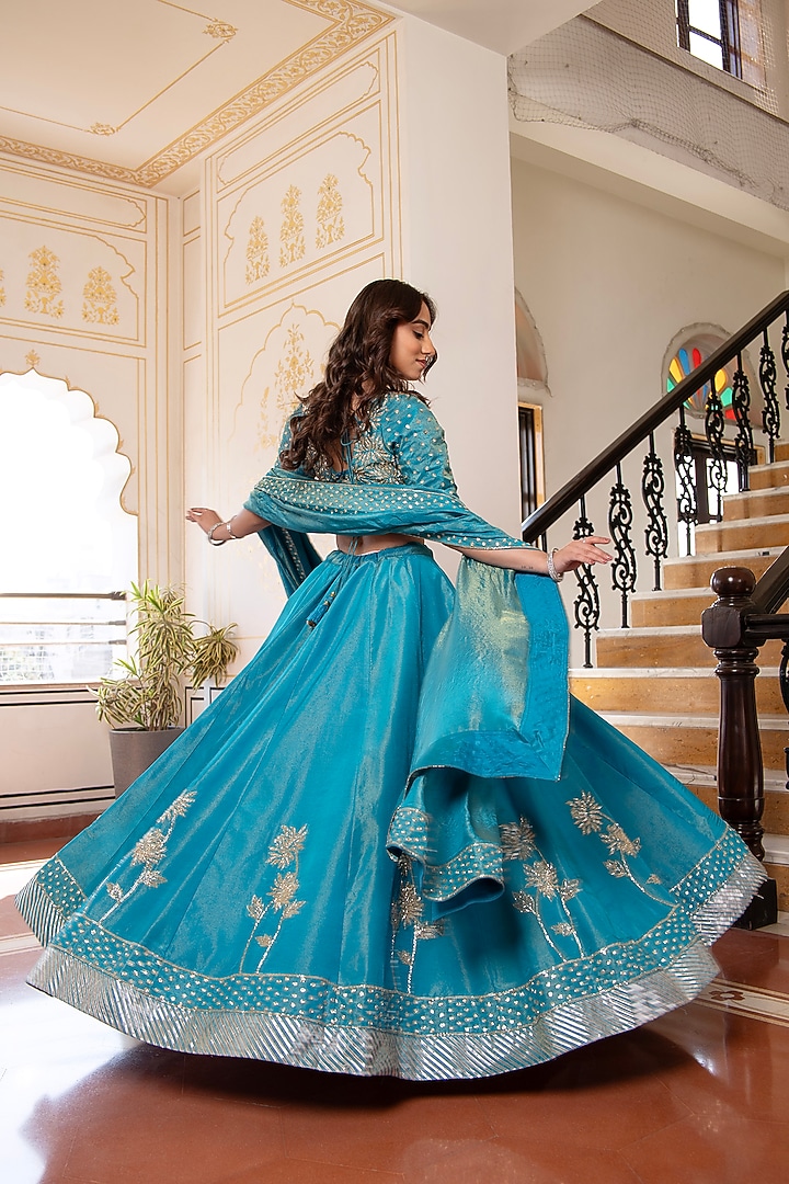 Blue Cosmos Silk Hand Embroidered Wedding Lehenga Set by Pomcha Jaipur at Pernia's Pop Up Shop