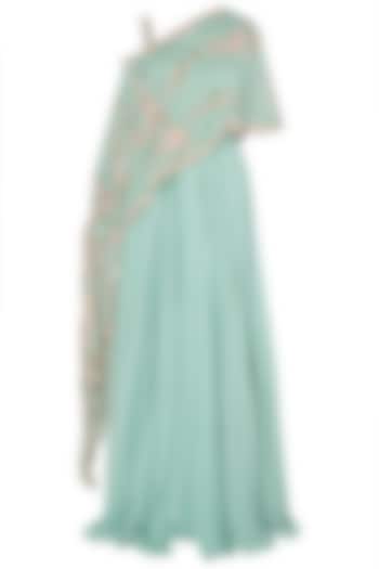 Turquoise asymmetrical embroidered cape with lehenga skirt available only at Pernia's Pop Up Shop.
