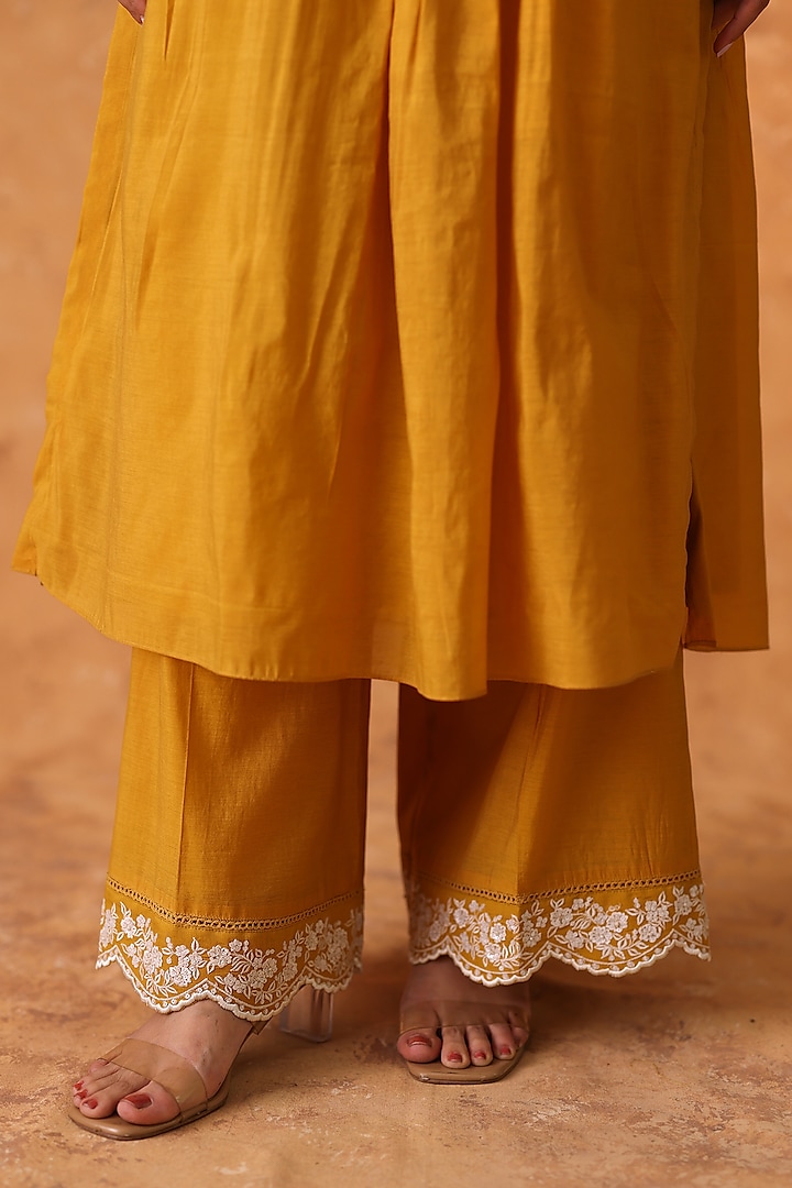 Yellow Chanderi Embroidered Asymmetric Kurta Set by POULI at Pernia's Pop Up Shop