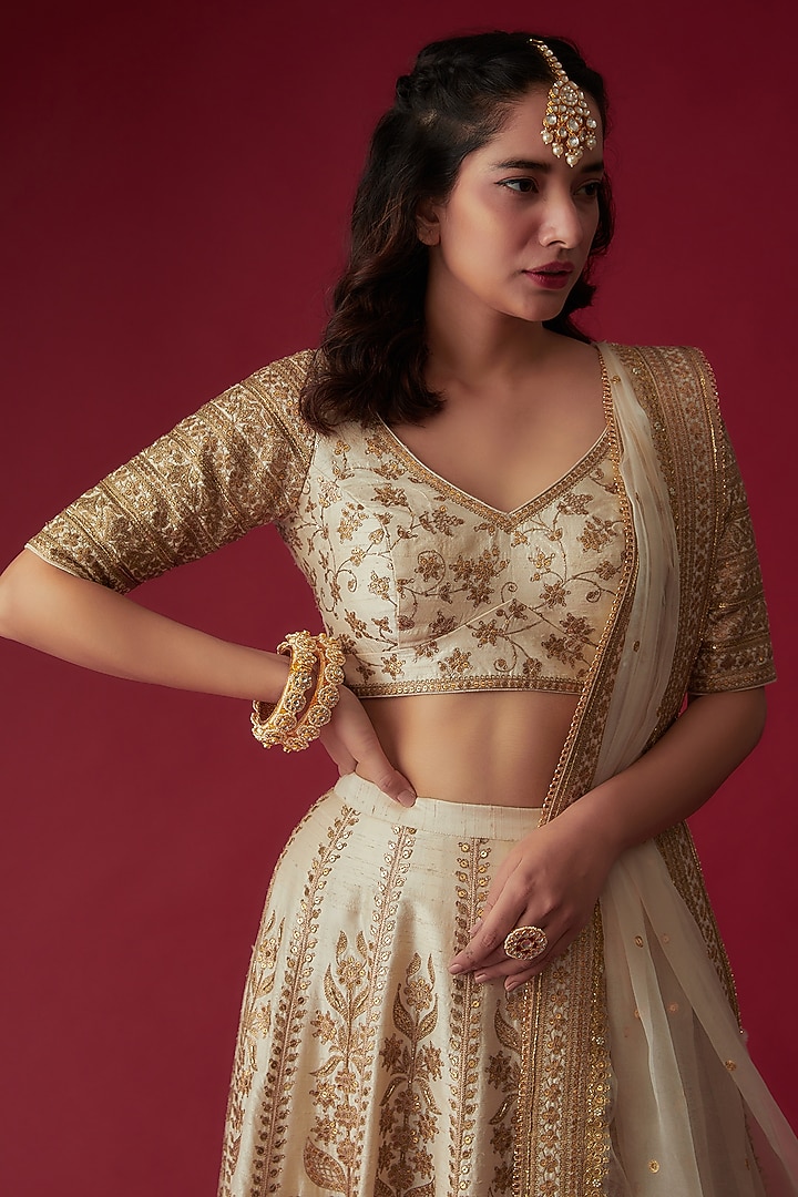 Off-White Raw Silk Embroidered Bridal Lehenga Set by Pooja & Keyur at Pernia's Pop Up Shop