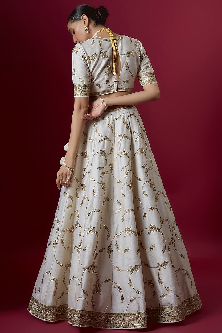 Off-White Raw Silk Embroidered Bridal Lehenga Set by Pooja & Keyur at Pernia's Pop Up Shop